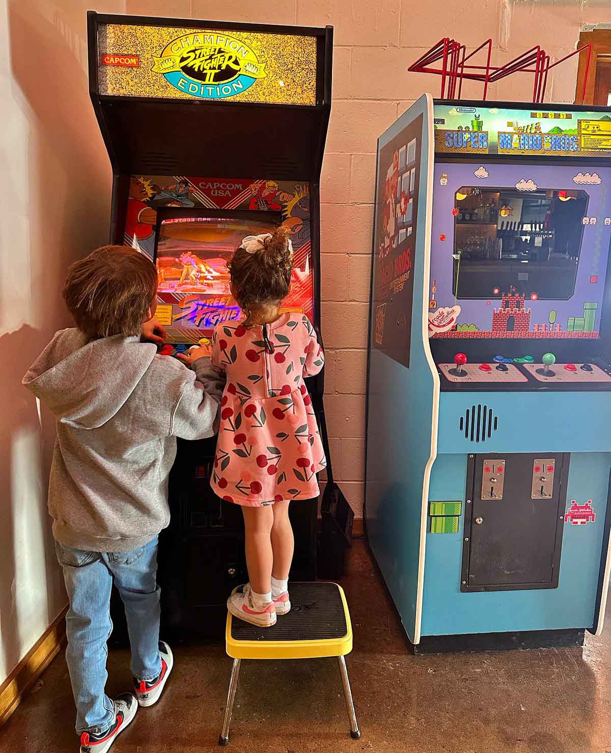 Kids Playing Arcade Game at Sauced